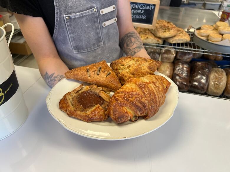 A plate of four pastries.