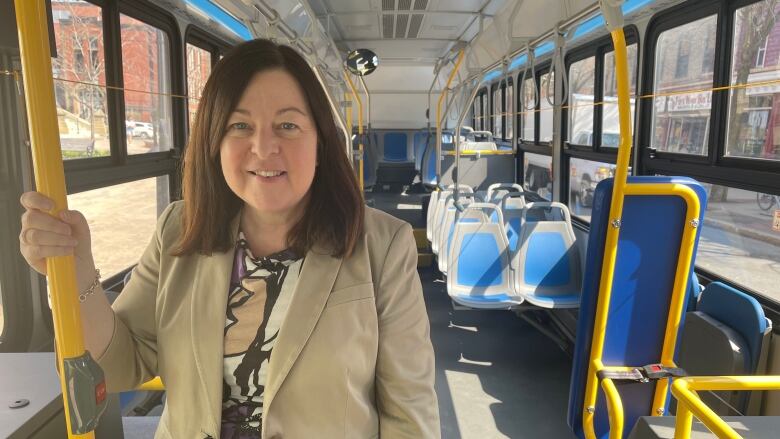 Woman standing in a bus