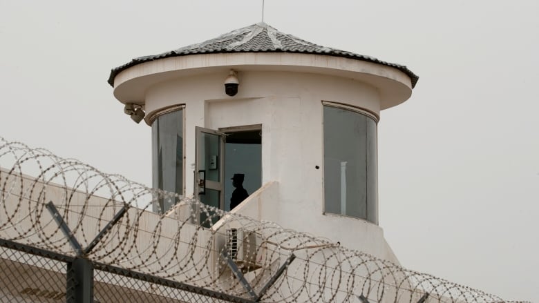 A guard stands in a watchtower of Kashgar prison in Kashgar, Xinjiang Uyghur Autonomous Region, China, May 3, 2021. Picture taken May 3, 2021.