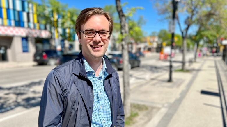 Adrian Schulz is a mortgage broker at Centum Financial Services in Winnipeg. He stands outside his office on the city's Sherbrook Street on June 3, 2022.