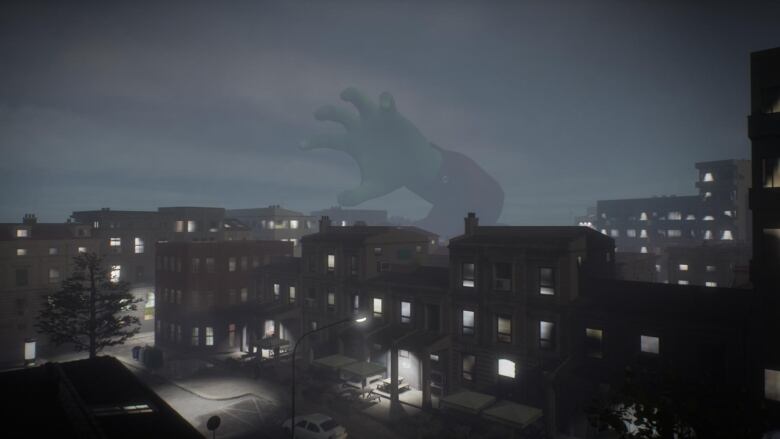 A giant hand rising from a city landscape in a video game.