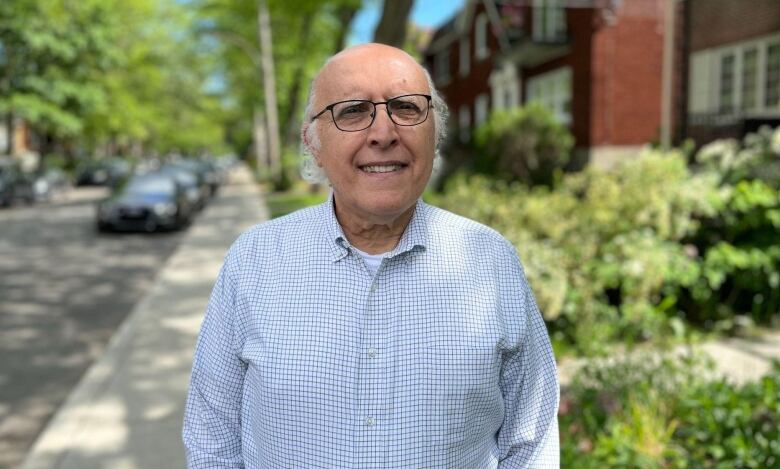 A man standing outside smiling