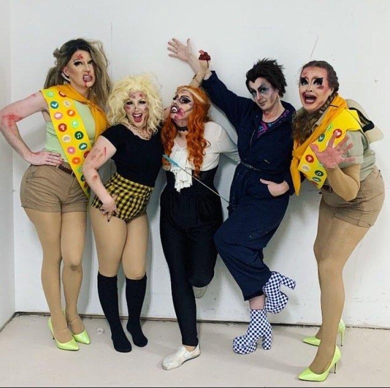 A lineup of beaten and bruised-looking (all part of the show) drag performers that make up the Phlegm Fatales performance group.