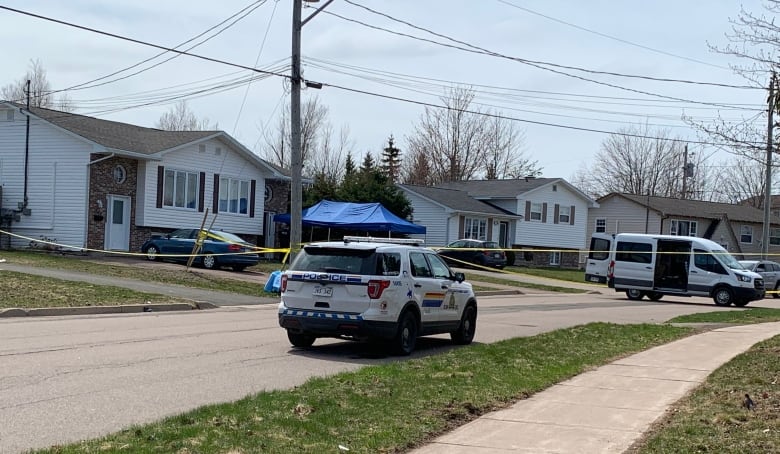 A police SUV parked on a suburban street.