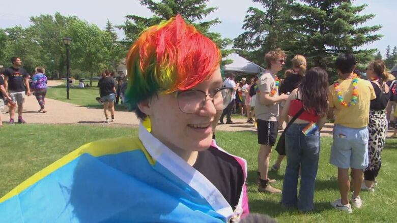 Abby Babiak, who has rainbow-dyed hair, smiles in a photo at the Brandon Pride parade on Saturday.