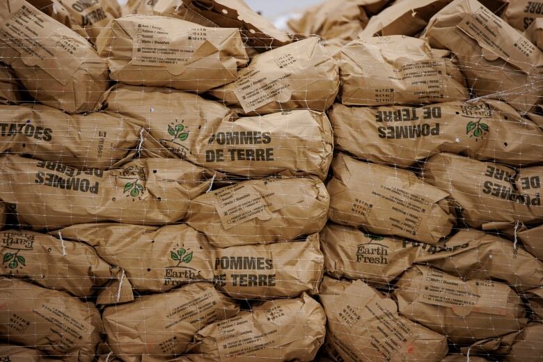 Donors and members of the public attend a grand opening event for Second Harvest, which redistributes food from industry to the needy, in Etobicoke, on April 6, 2022.