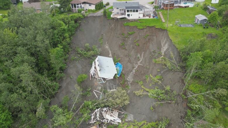 destroyed house on steep hill