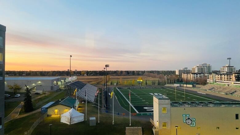 A view of a football field and open skies. 