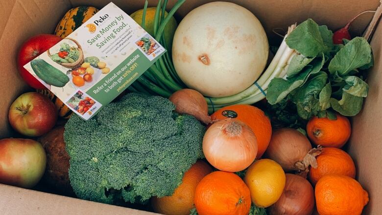 A box of fruits and vegetables.