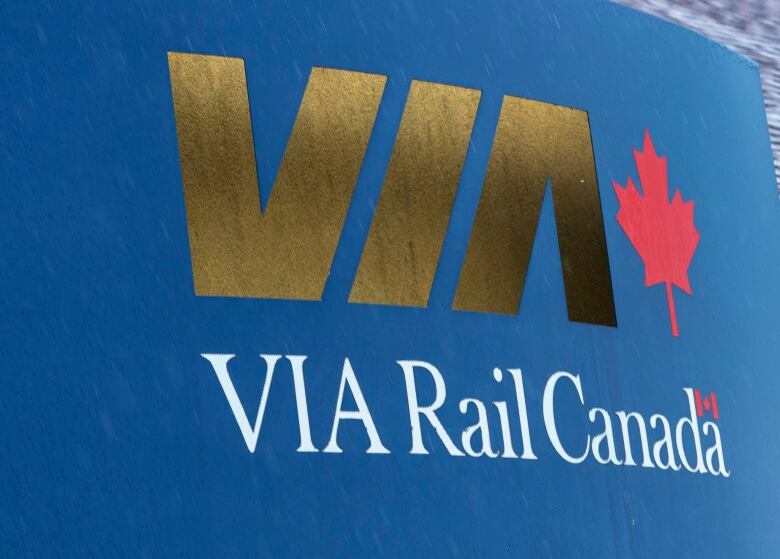 A blue Via Rail sign.