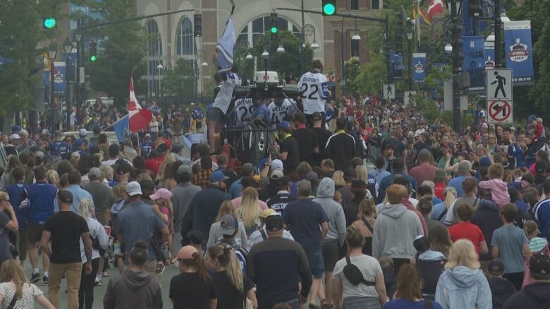 A huge parade of hockey fans on the streets of uptown Saint John