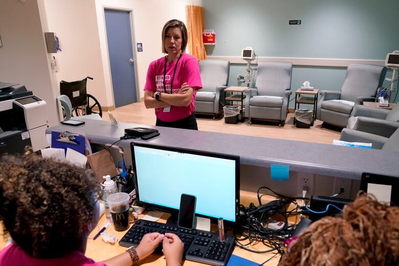 Dr. Jill Gibson, medical director for Planned Parenthood Arizona, speaks with her staff Thursday, June 30, 2022 at the Planned Parenthood facility in Tempe, Ariz. 