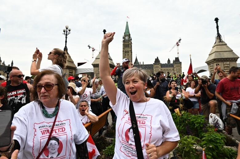 People protest outside Parliament Hill.