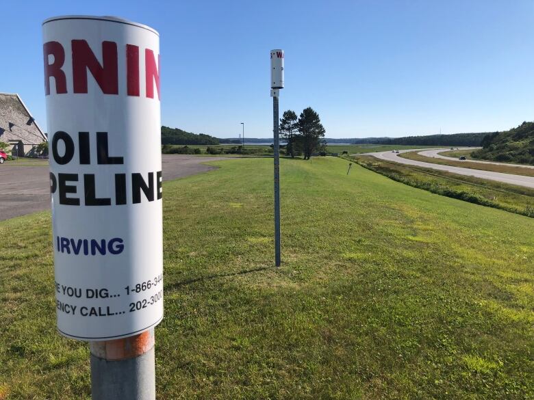 A pole has a sign which reads Irving Oil.