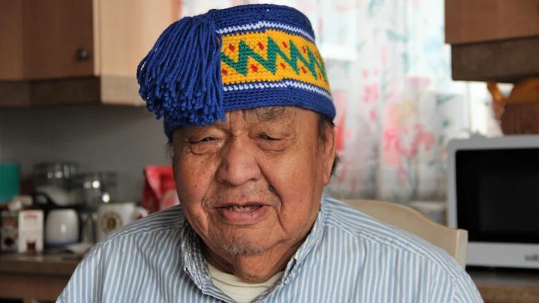 A closeup of an elderly Indigenous man.