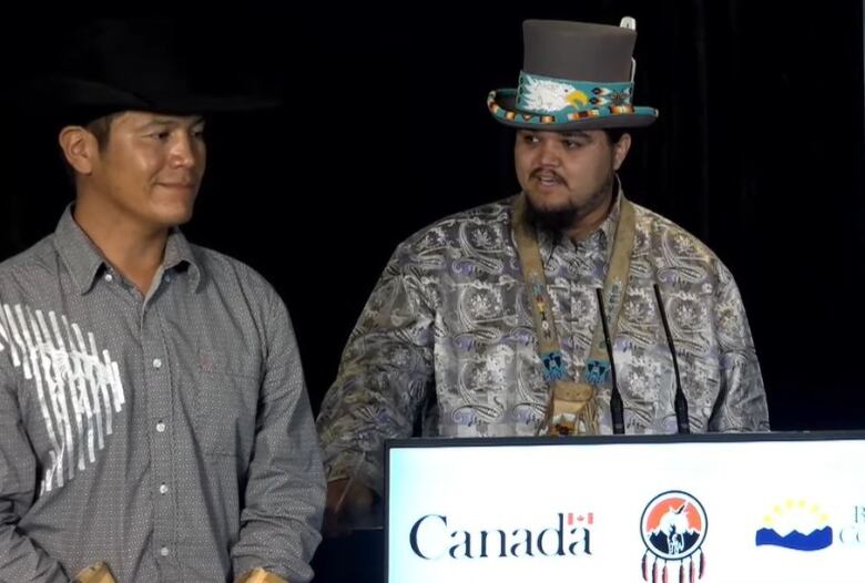 Tsilhqotin National Government representatives Jimmy Lulua (left), chief of Xeni Gwet'in First Nation, and the Nation's cultural, negotiations and external affairs ambassador Peyal Laceese speak in Vancouver on Wednesday, July 6, 2022, after the TNG signed a renewed emergency management agreement with the province and Ottawa.