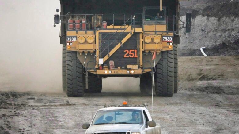 car and dumptruck on oil site