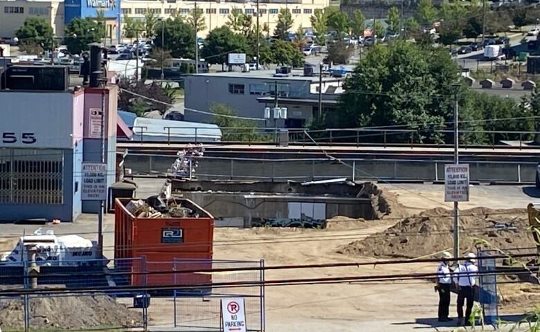 A section of rooftop parking deck that collapsed into the office space below is seen on Lougheed Highway in East Vancouver on Thursday, July 14, 2022.