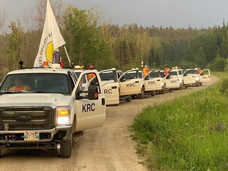 KRC trucks line up on a road.