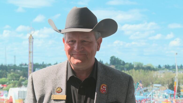 A man in a cowboy hat.