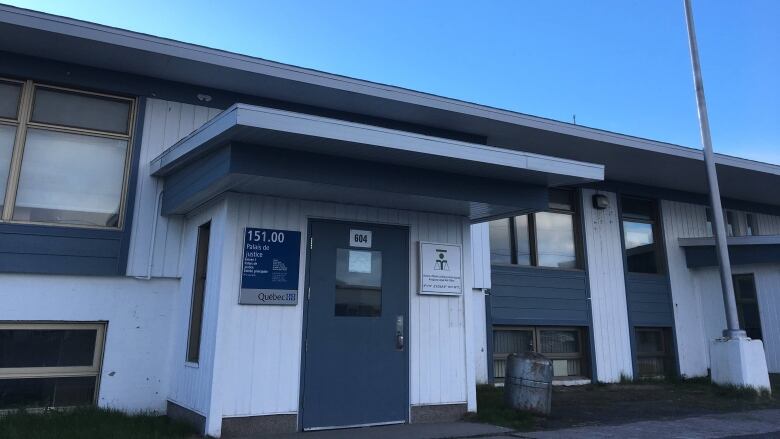 A small blue and white building.