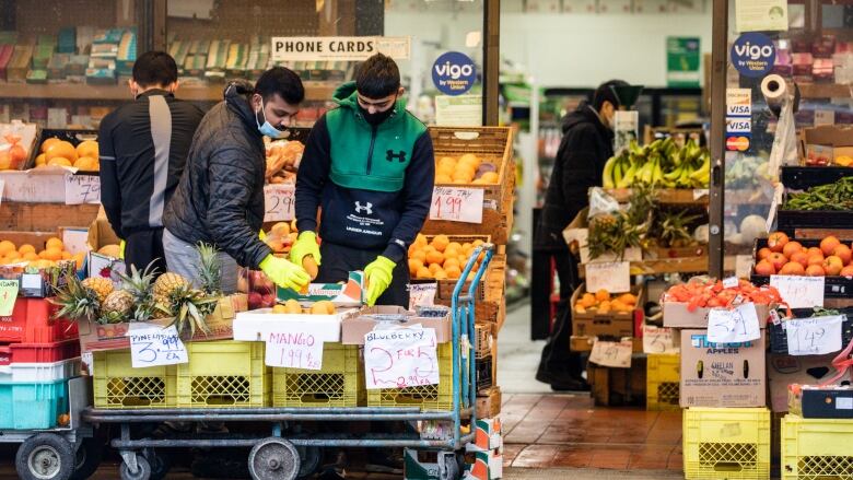 Shoppers are pictured buying groceries in Vancouver in January this year.