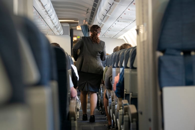 Flight attendants inside an Air Canada flight