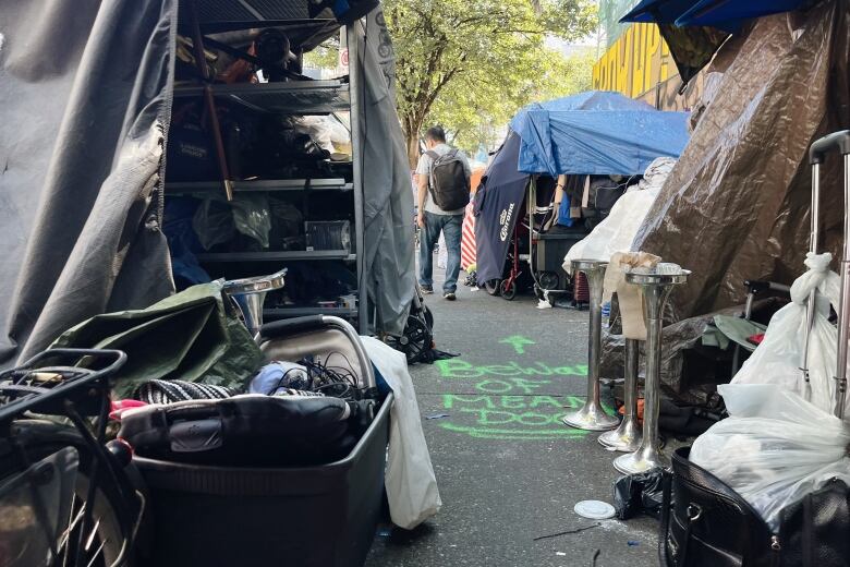 Tents and structures line the street.