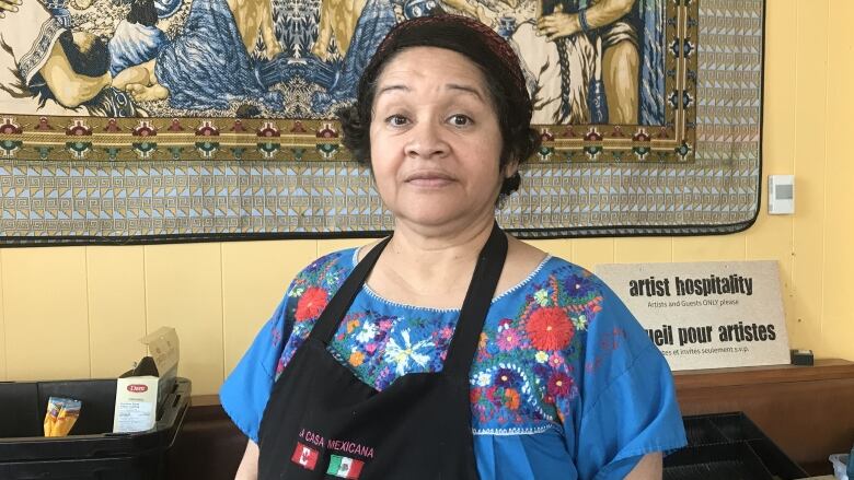 Sylvia Rios stands in her restaurant called La Casa Mexicana.