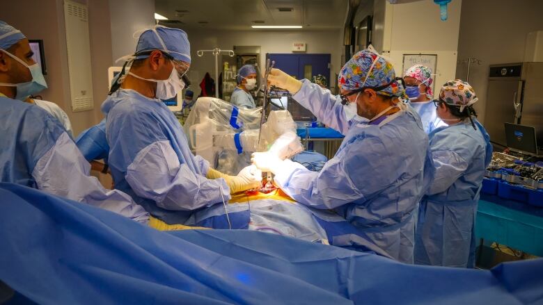 Doctors in an operating room.