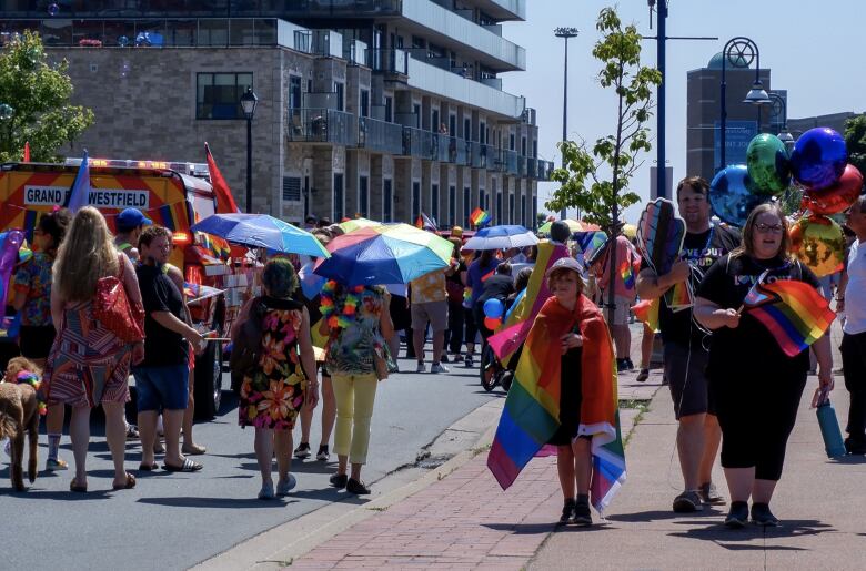 people walking in a pride parade