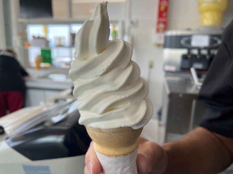 A soft serve vanilla cone.