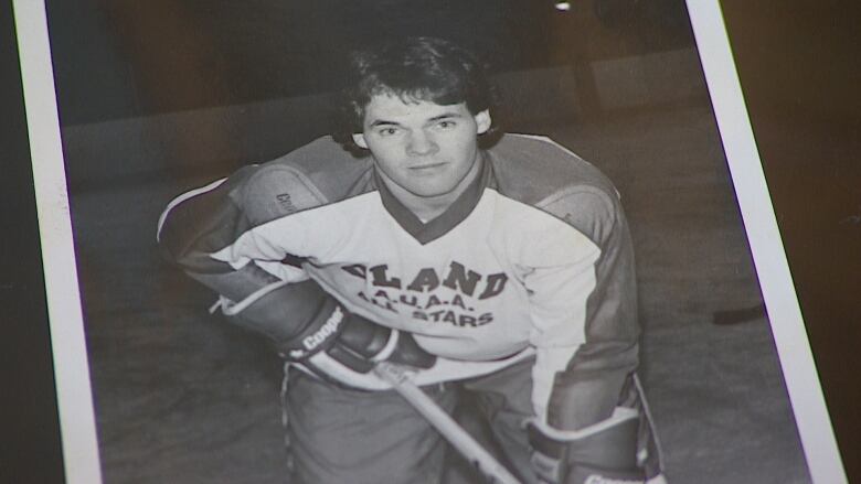 Tim Skuce is shown playing hockey when he was younger.