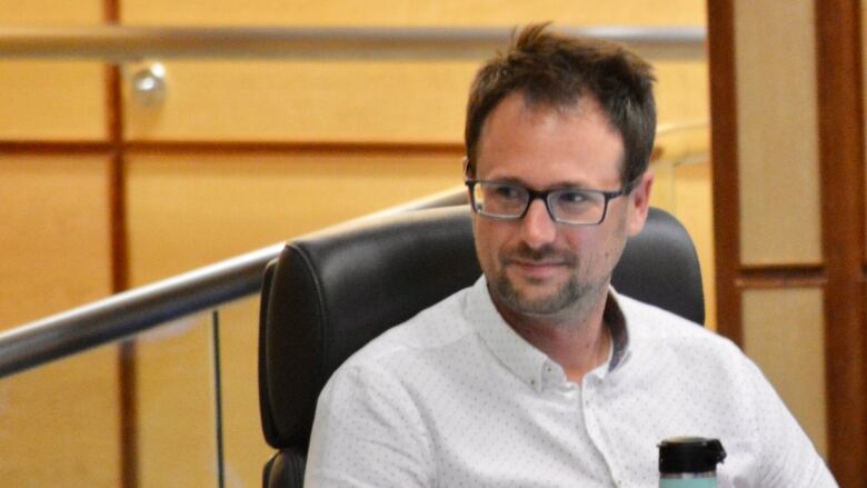 Man at a city council meeting.