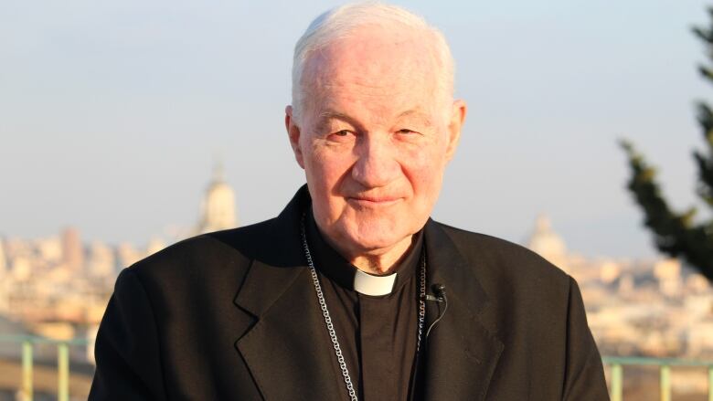 Picture of a priest dressed in black.