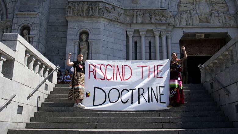 Sarain Fox, right, and Chelsea Brunelle of the Batchewana First Nation unfurled a banner reading 