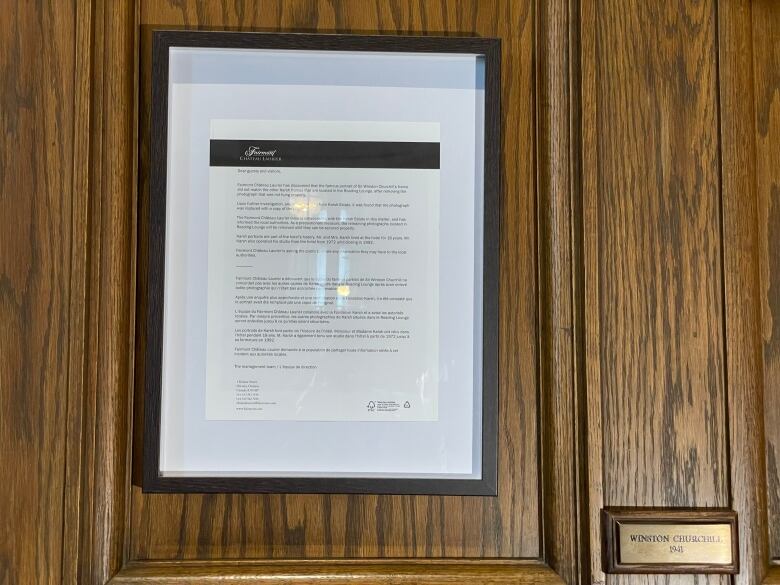 A photo of a framed note where a portrait of Winston Churchill was.