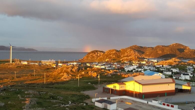 A rural town overlooking cliffs and ocean.