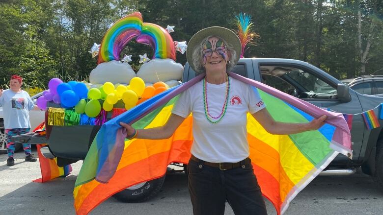 Brenda Hattie poses with a rainbow flag at last year's Eastern Shore Pride parade.