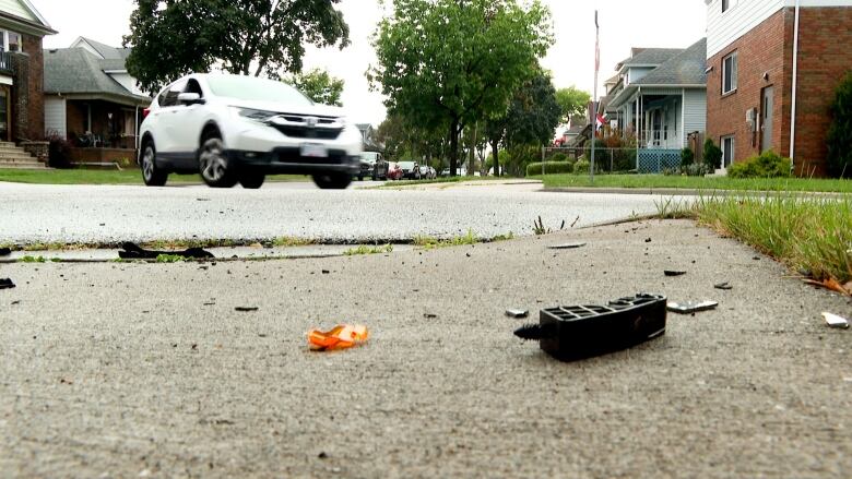 Remenants of a weekend crash in Walkerville remain on the sidewalk the next day.