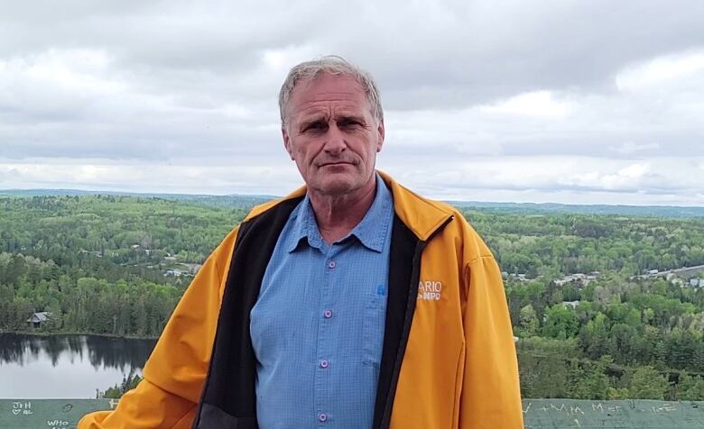 Timiskaming-Cochrane MPP John Vanthof stands overlooking the forest surrounding the town of Temagami. 