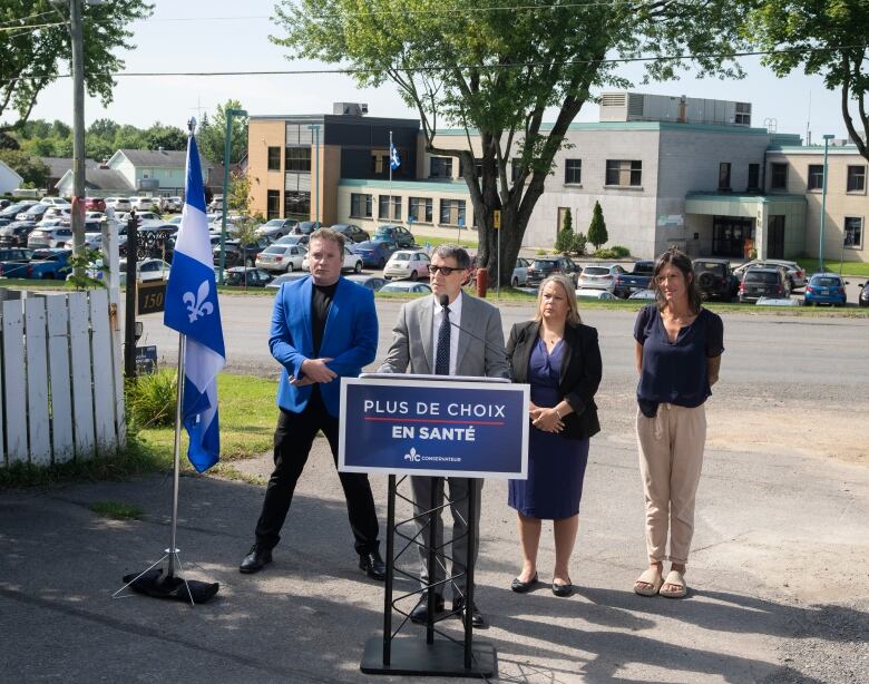 Quebec Conservative Party leader Eric Duhaime speaks to the media in front of the Lachute, Que., hospital while campaigning. 