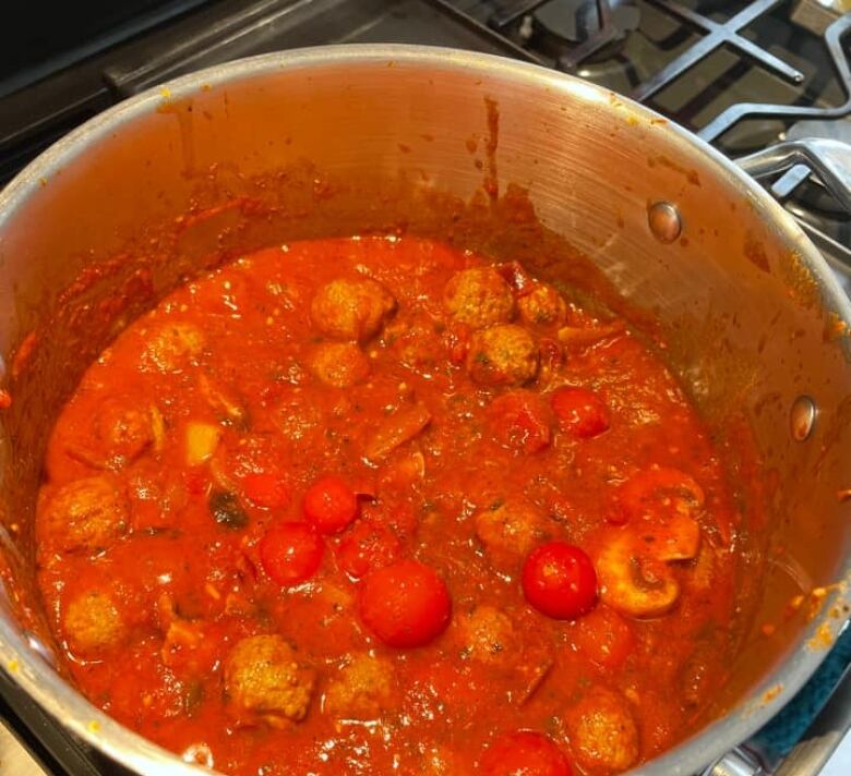 Closeup look into a pot of red spaghetti sauce