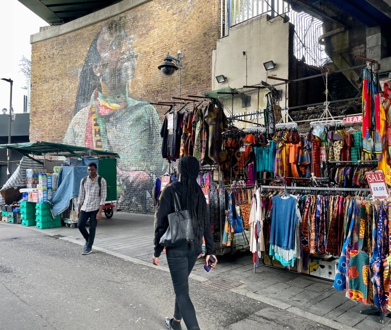 A woman walks down the street.