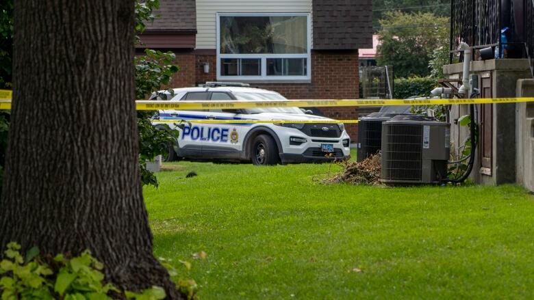 A police cruiser in a residential neighbourhood.