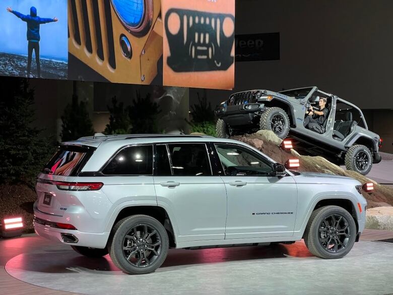 A silver SUV on a display