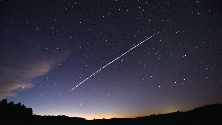 A shooting-star-like trail in the night sky.