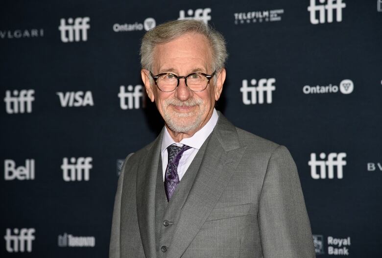 man in front of TIFF signage