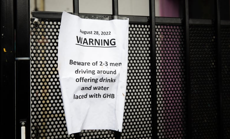 A sign warns women of men offering drinks laced with GHB.