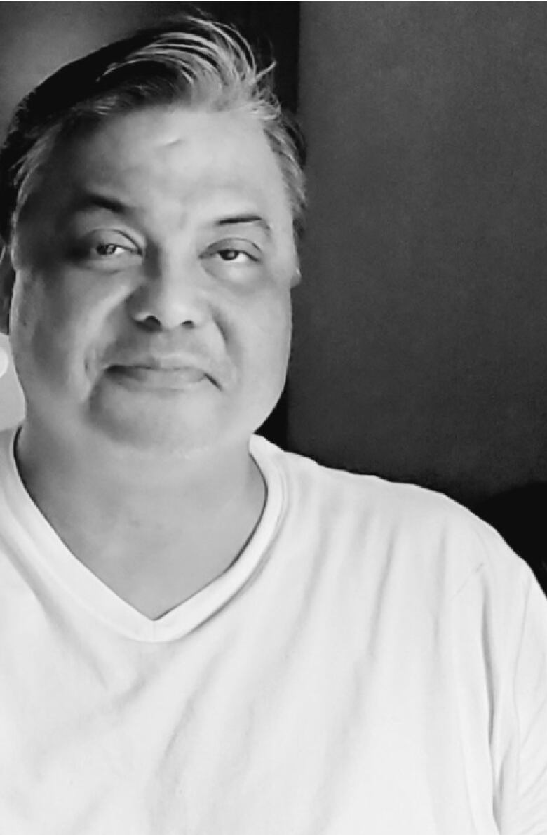 Black and white photos of man wearing white t-shirt